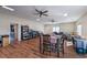 Large living room area featuring wood flooring and abundant light at 5700 E Carter Ln, Pahrump, NV 89061