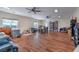 Expansive living area features wood flooring, multiple ceiling fans and abundant light at 5700 E Carter Ln, Pahrump, NV 89061