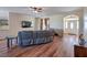 Inviting living room boasts hardwood floors, ceiling fan, and media center at 5700 E Carter Ln, Pahrump, NV 89061
