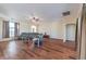 Spacious living room with hardwood floors, ceiling fan, and plenty of natural light at 5700 E Carter Ln, Pahrump, NV 89061