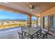Covered patio provides outdoor dining with mountain views at 5700 E Carter Ln, Pahrump, NV 89061
