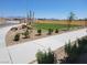 Spacious backyard with fresh sod, tasteful desert landscaping, and a privacy fence at 6104 Aster Garden St # 129, North Las Vegas, NV 89081