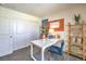 Bedroom features a functional desk, closet, and a comfortable workspace for productivity at 6104 Aster Garden St # 129, North Las Vegas, NV 89081