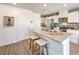 Bright kitchen with quartz countertops, stainless steel appliances, and ample cabinet space at 6104 Aster Garden St # 129, North Las Vegas, NV 89081
