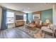 Inviting living room with ample natural light, contemporary furniture, and stylish decor at 6104 Aster Garden St # 129, North Las Vegas, NV 89081