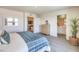 Serene main bedroom featuring modern decor, comfortable furnishings, and an en suite bathroom at 6104 Aster Garden St # 129, North Las Vegas, NV 89081