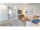 Bright sitting room featuring modern decor, ample lighting, and an inviting atmosphere at 6104 Aster Garden St # 129, North Las Vegas, NV 89081