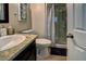 Bathroom featuring a single sink vanity, granite countertop and shower with glass doors at 614 Ravenglen Dr, Las Vegas, NV 89123
