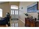 Bright foyer featuring a decorative tile floor design, high ceilings, and a double-door entryway at 614 Ravenglen Dr, Las Vegas, NV 89123