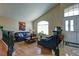 Comfortable living room featuring high ceilings, large windows, and an open layout at 614 Ravenglen Dr, Las Vegas, NV 89123