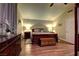 Serene main bedroom with hardwood floors, a ceiling fan, and a comfortable bed and dresser set at 614 Ravenglen Dr, Las Vegas, NV 89123