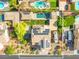 Drone's-eye view of home's layout, pool, solar panels, and backyard at 6335 Iginlas Goal Ave, Las Vegas, NV 89131