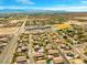 Expansive aerial shot of the neighborhood, showcasing the community layout and distant mountain views at 6335 Iginlas Goal Ave, Las Vegas, NV 89131