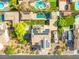 Drone's-eye view of home's layout, pool, solar panels, and backyard at 6335 Iginlas Goal Ave, Las Vegas, NV 89131