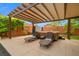 Relaxing backyard featuring a hot tub, lounge chairs, concrete patio, and manicured landscaping at 6335 Iginlas Goal Ave, Las Vegas, NV 89131