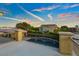 View from balcony of backyard swimming pool, grassy area, and surrounding neighborhood at 6335 Iginlas Goal Ave, Las Vegas, NV 89131