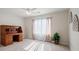Bedroom featuring a ceiling fan, carpet, and a wooden writing desk at 6335 Iginlas Goal Ave, Las Vegas, NV 89131