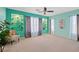 Bedroom featuring carpet, sheer curtains, and mint green walls at 6335 Iginlas Goal Ave, Las Vegas, NV 89131