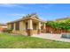 Quaint detached casita with charming stone accents and a private patio, overlooking the grassy backyard at 6335 Iginlas Goal Ave, Las Vegas, NV 89131