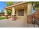Cozy casita entrance with stone pillars and a gated patio, perfect for a private retreat at 6335 Iginlas Goal Ave, Las Vegas, NV 89131