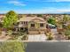 Inviting home with a well manicured front yard and a spacious three-car garage at 6335 Iginlas Goal Ave, Las Vegas, NV 89131