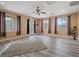 Bright flex room featuring stylish curtains, wood-look flooring, and a ceiling fan at 6335 Iginlas Goal Ave, Las Vegas, NV 89131