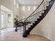 Grand foyer featuring an elegant staircase and soaring ceilings at 6335 Iginlas Goal Ave, Las Vegas, NV 89131