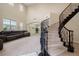 Elegant foyer featuring a grand staircase, soaring ceilings, and an open layout at 6335 Iginlas Goal Ave, Las Vegas, NV 89131
