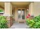Inviting front entryway with stone accents and decorative glass double doors at 6335 Iginlas Goal Ave, Las Vegas, NV 89131