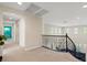 Upstairs hallway featuring an elegant wrought iron staircase at 6335 Iginlas Goal Ave, Las Vegas, NV 89131