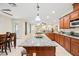 Large kitchen with a spacious island, granite countertops, stainless appliances and access to outdoor patio at 6335 Iginlas Goal Ave, Las Vegas, NV 89131