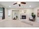 Open living area features a fireplace and neutral decor at 6335 Iginlas Goal Ave, Las Vegas, NV 89131