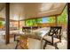 Elegant outdoor kitchen with granite countertops, comfortable seating, and a built-in grill at 6335 Iginlas Goal Ave, Las Vegas, NV 89131