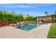Refreshing pool with multiple water features and a large, paved deck for entertaining at 6335 Iginlas Goal Ave, Las Vegas, NV 89131