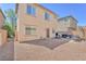 Large backyard with gravel landscaping and outdoor grilling station at 637 Taliput Palm Pl, Henderson, NV 89011