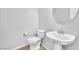 Clean and functional half bathroom with toilet, pedestal sink and modern fixtures at 637 Taliput Palm Pl, Henderson, NV 89011