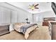 Stylish bedroom with modern furniture, large windows, and a cozy bed at 637 Taliput Palm Pl, Henderson, NV 89011