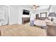 Spacious bedroom with carpet, large windows, and ample closet space, providing a comfortable retreat at 637 Taliput Palm Pl, Henderson, NV 89011