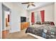 Comfortable bedroom with carpet, large windows, and a cozy bed at 637 Taliput Palm Pl, Henderson, NV 89011