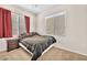 Comfortable bedroom with carpet, large windows, and a cozy bed at 637 Taliput Palm Pl, Henderson, NV 89011