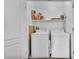 A tidy laundry room with a washer, dryer, and shelving at 637 Taliput Palm Pl, Henderson, NV 89011