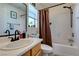 Clean bathroom featuring a shower-tub combo and a bright vanity at 6576 Buster Brown Ave # 101, Las Vegas, NV 89122