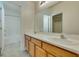 This bathroom features a double sink vanity, tile floors, and a shower and bath combination at 6576 Buster Brown Ave # 101, Las Vegas, NV 89122