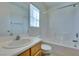 This bathroom has a shower and bath combination with a single sink vanity and standard toilet at 6576 Buster Brown Ave # 101, Las Vegas, NV 89122