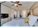 Neutral bedroom showcasing a four-poster bed with warm decor and an ensuite bathroom at 6576 Buster Brown Ave # 101, Las Vegas, NV 89122