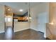 An open floor plan showing the dining area, kitchen, and hallway at 6576 Buster Brown Ave # 101, Las Vegas, NV 89122
