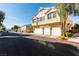 Charming townhome featuring a multi-car garage, desert landscaping, and proximity to neighborhood amenities at 6576 Buster Brown Ave # 101, Las Vegas, NV 89122