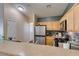 Bright kitchen features stainless steel appliances and ample cabinet space at 6576 Buster Brown Ave # 101, Las Vegas, NV 89122