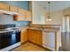 Kitchen area showcasing wood cabinets and stainless steel sink at 6576 Buster Brown Ave # 101, Las Vegas, NV 89122