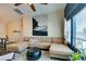 Living room featuring comfortable sectional sofa, area rug and lots of natural light at 6576 Buster Brown Ave # 101, Las Vegas, NV 89122